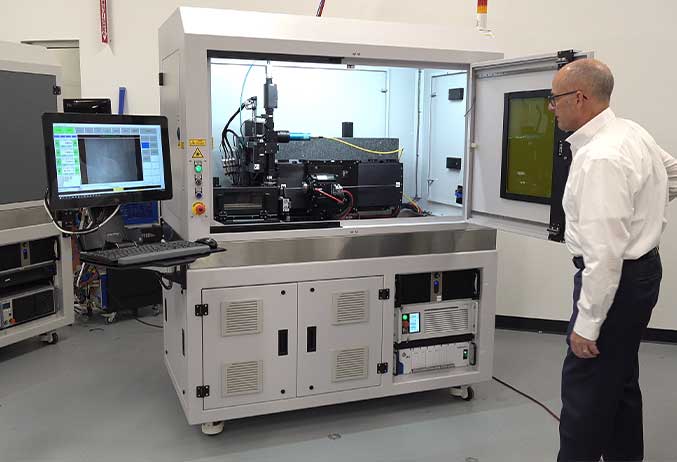 technician cutting stents on ILT Versa - IPG's stent cutting laser system